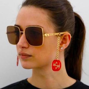 Authentic Gucci Sunglasses w/ red charms